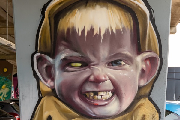 Aggressive boy pictured on a pillar of the Boshover Bridge in Weert